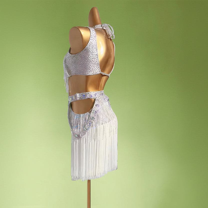 Mannequin wearing a silver sequin top and skirt on a light green background