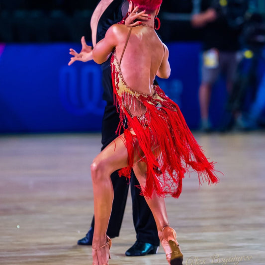 Gold and Vibrant Red Fringe Latin Dance Dress, Stunning gold and red fringe Latin dance dress adorned with crystals - perfect for competitions and performances. Shop now for exquisite dancewear at our online store.